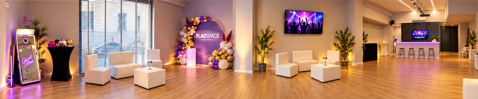 The FlacSpace venue in Benevento: photo booth, white seating, balloon arch with the FLACSPACE backdrop, big screen and bar