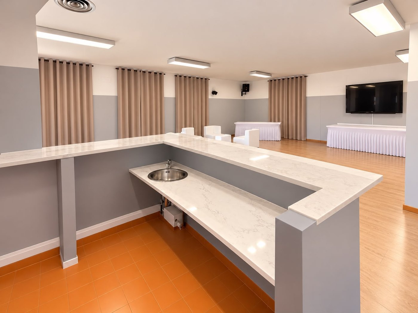 Sala Sole at FLAC Concorezzo: pale marble counter, curtains, big screen and laid tables