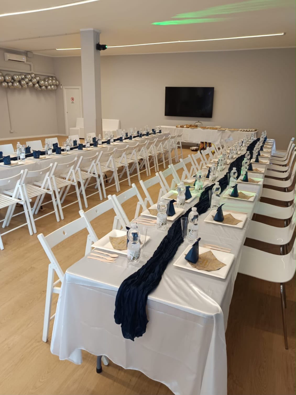 The same FlacSpace venue laid out banquet-style for a dinner